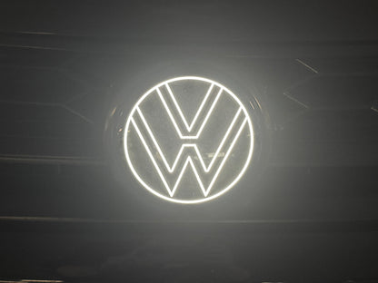 Volkswagen logo illuminated on a dark background